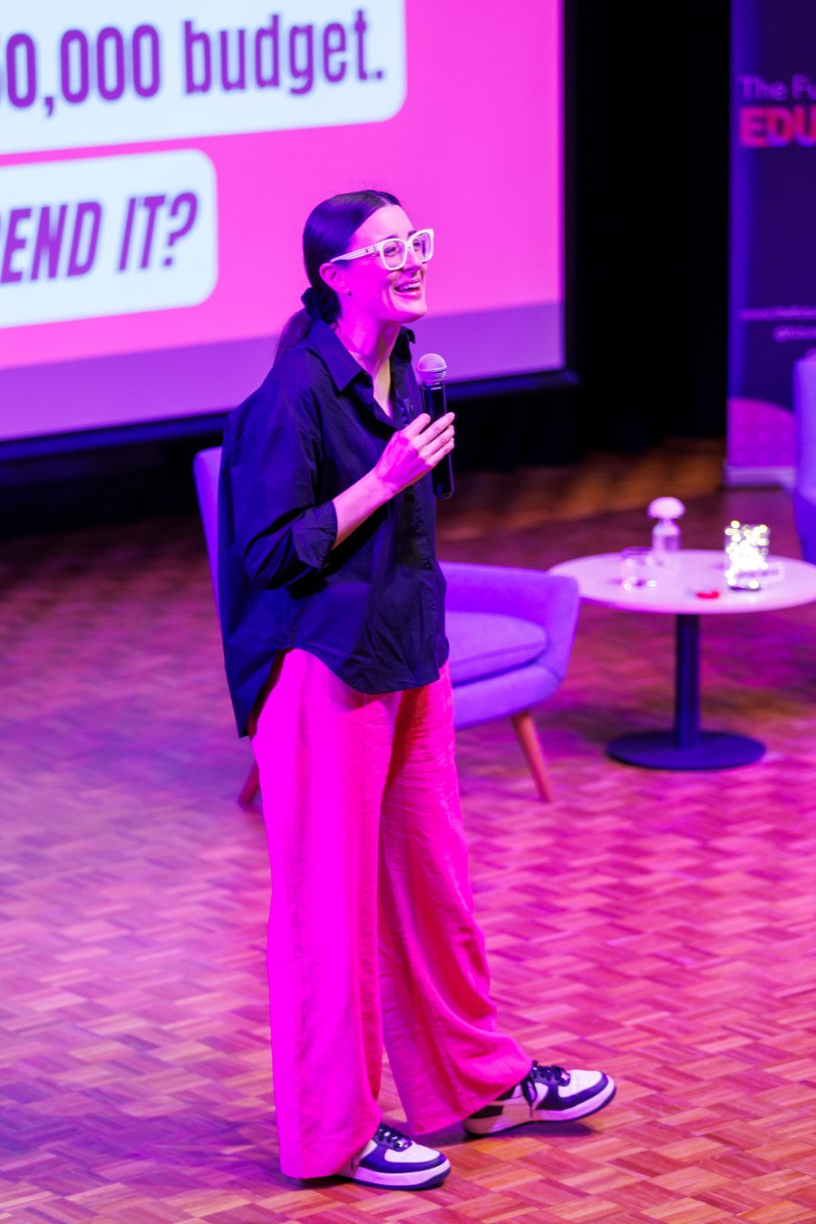 Alana Kilmartin presenting on stage