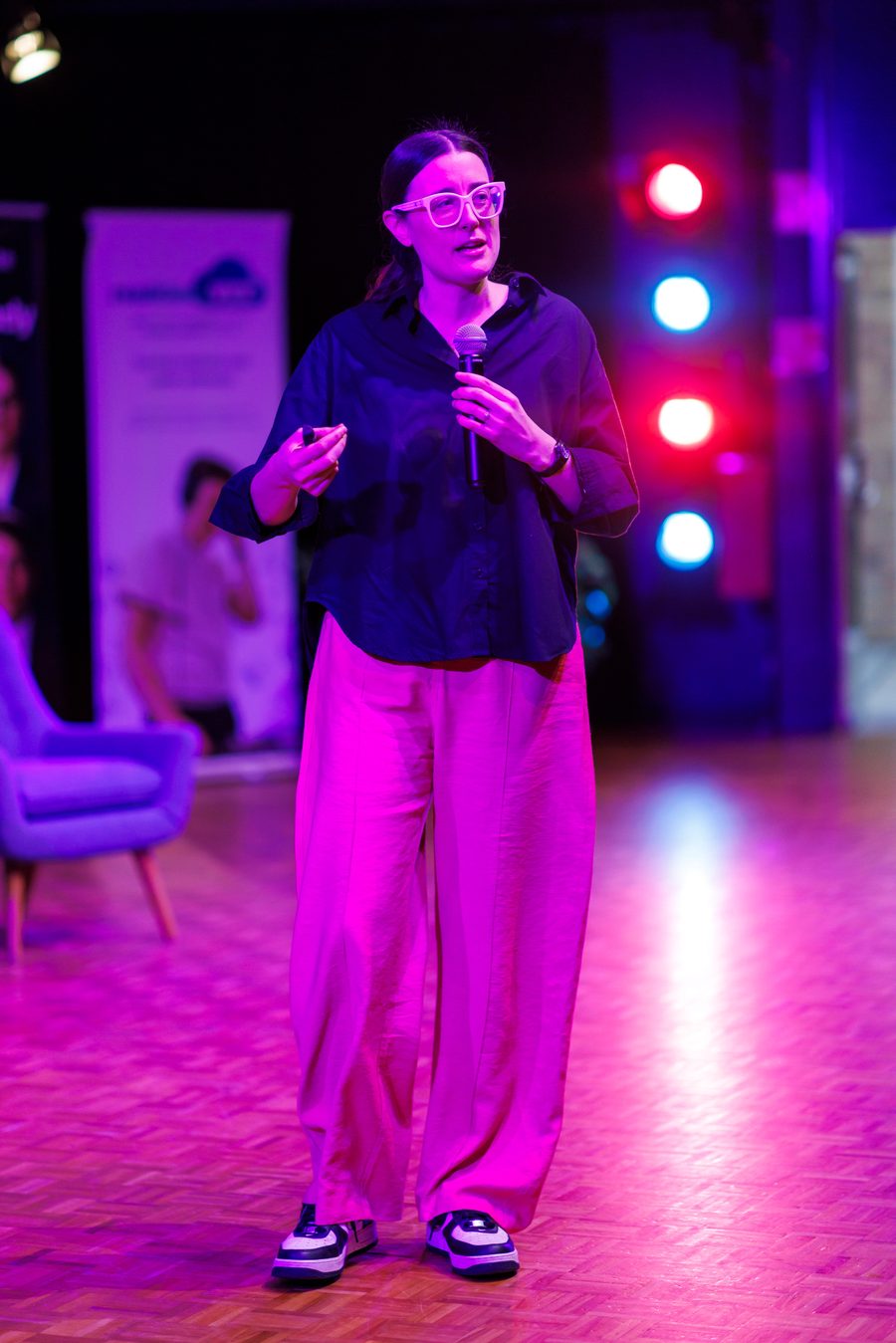 Alana Kilmartin presenting on stage