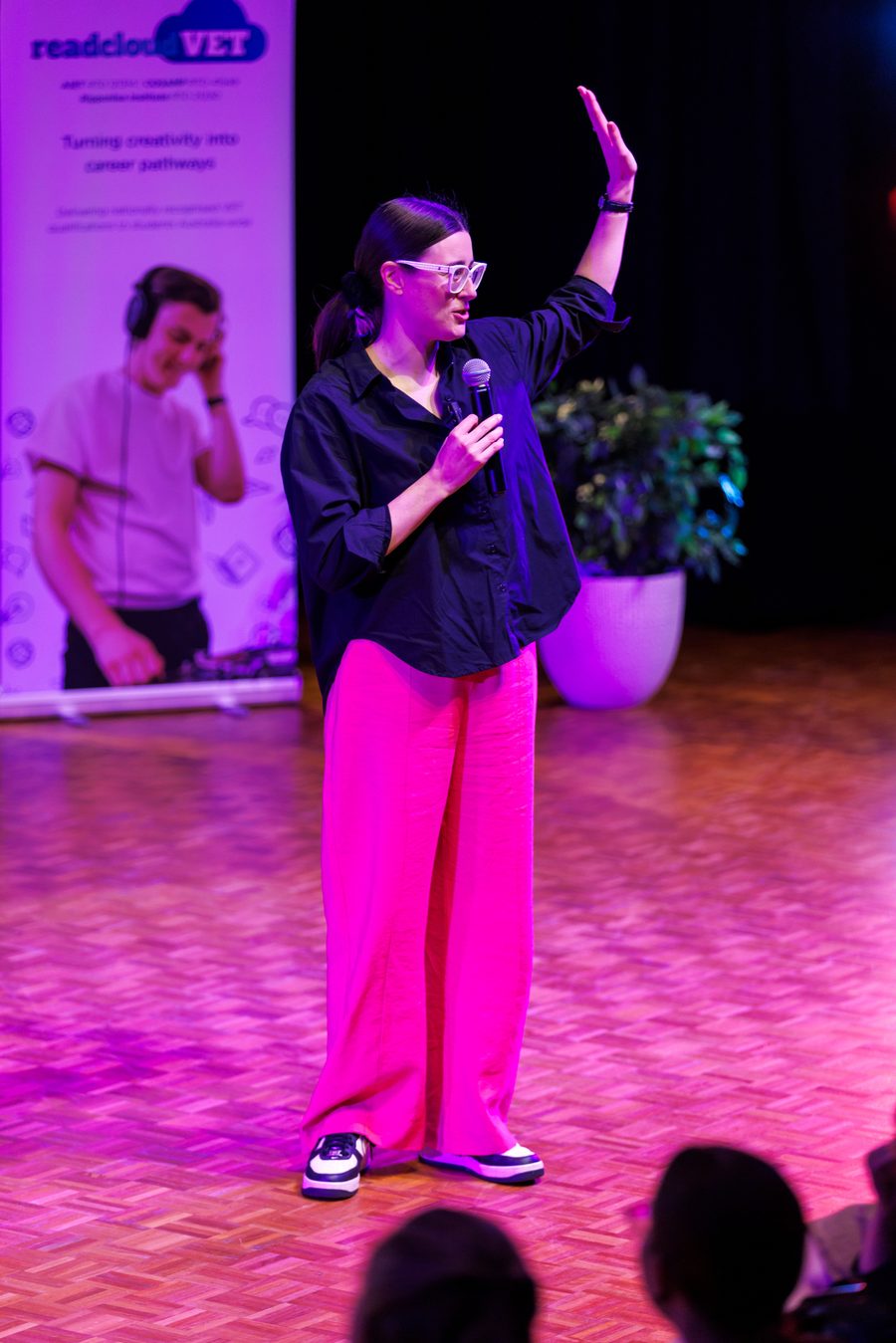 Alana Kilmartin presenting on stage